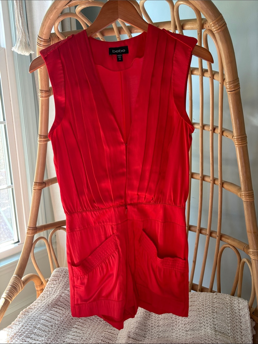 Beautiful Bebe satin vibrant red/orange romper with gold accents.